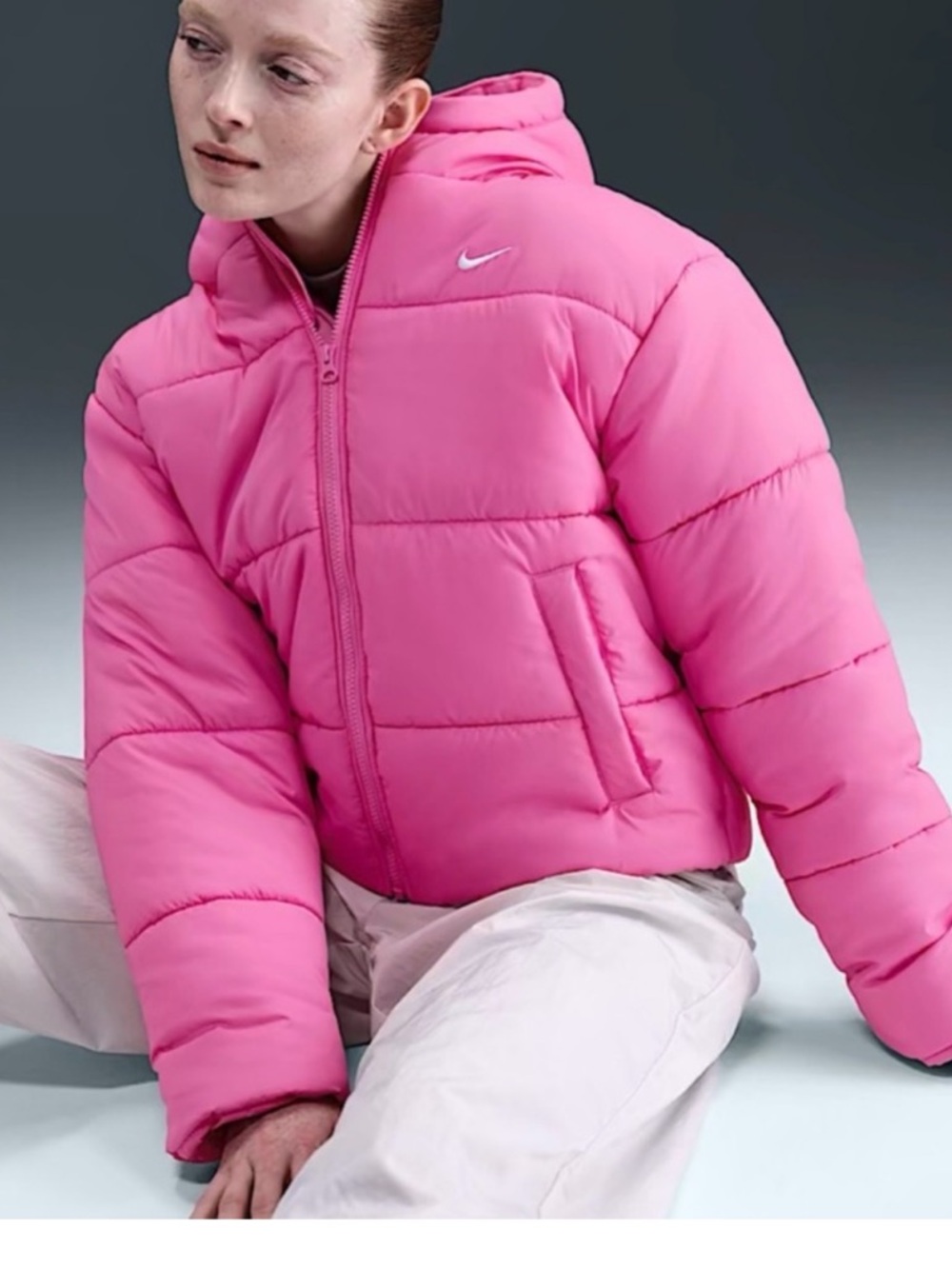 Nike Women's Therma-FIT
Hooded Puffer Jacket in bright pink. Medium